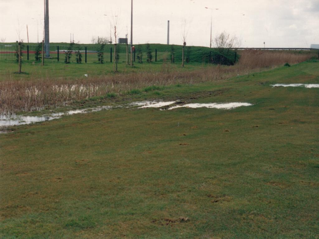 Running track to the left with floodlights